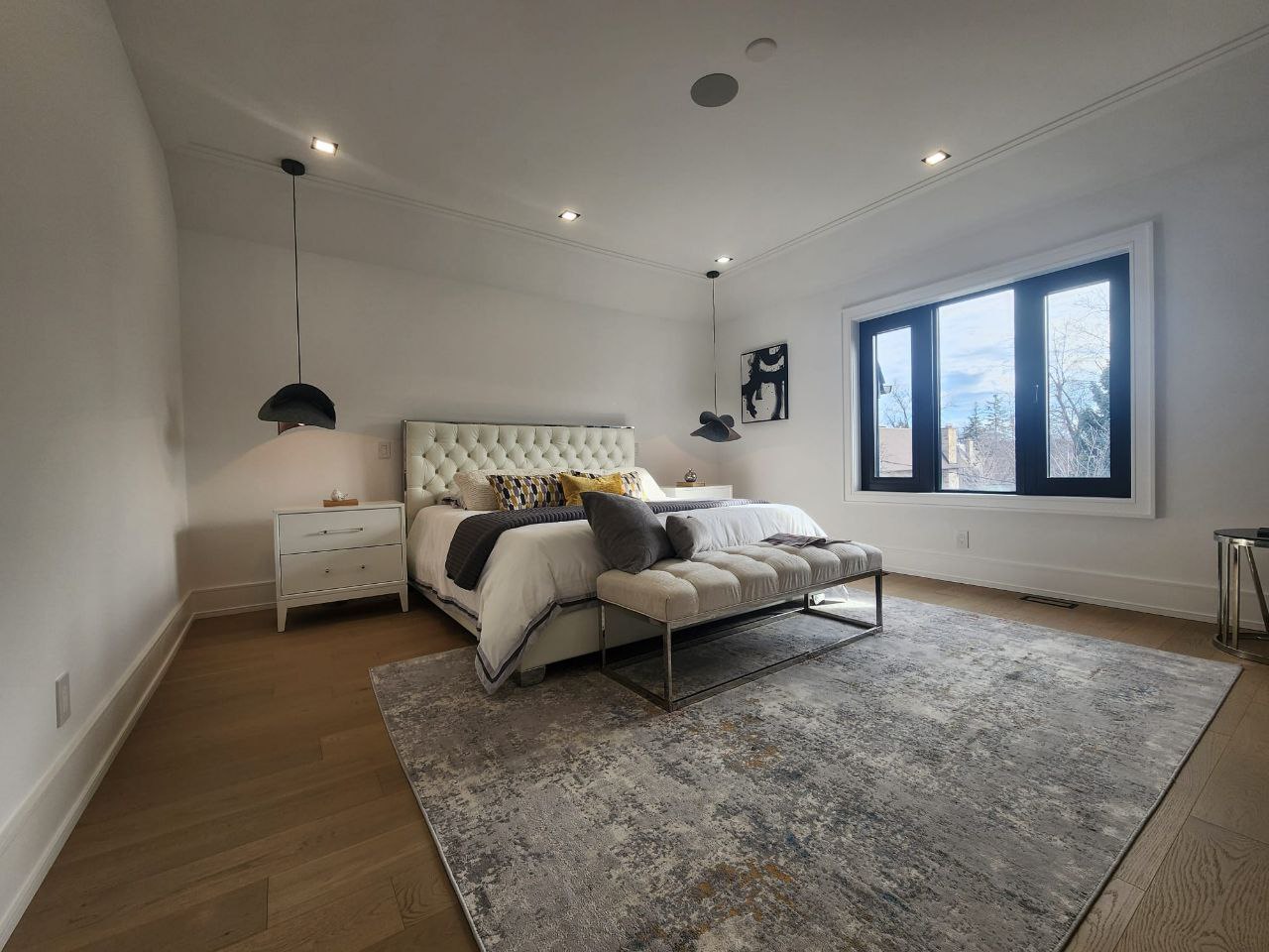 Master bedroom suite with large windows